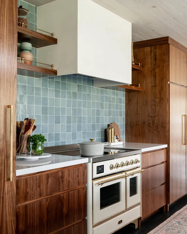 Walnut Cabinetry With Blue Tile Elegance