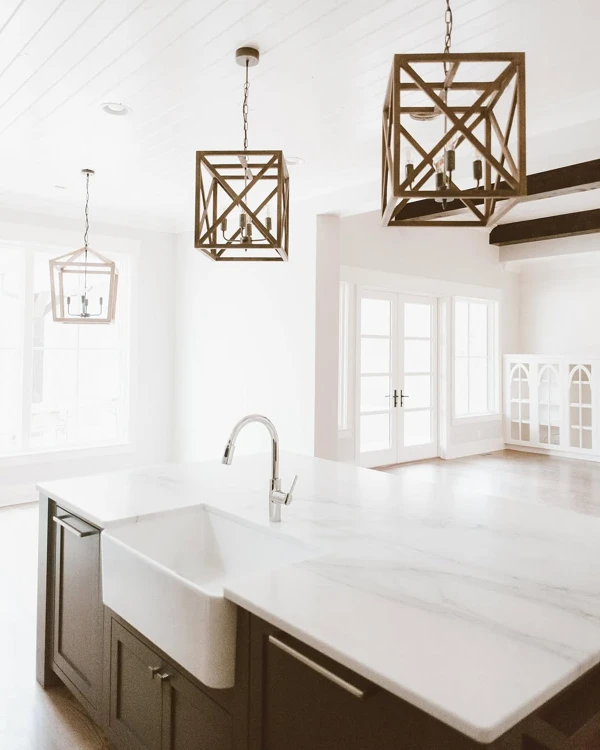 Geometric Pendants Above Marble Farmhouse