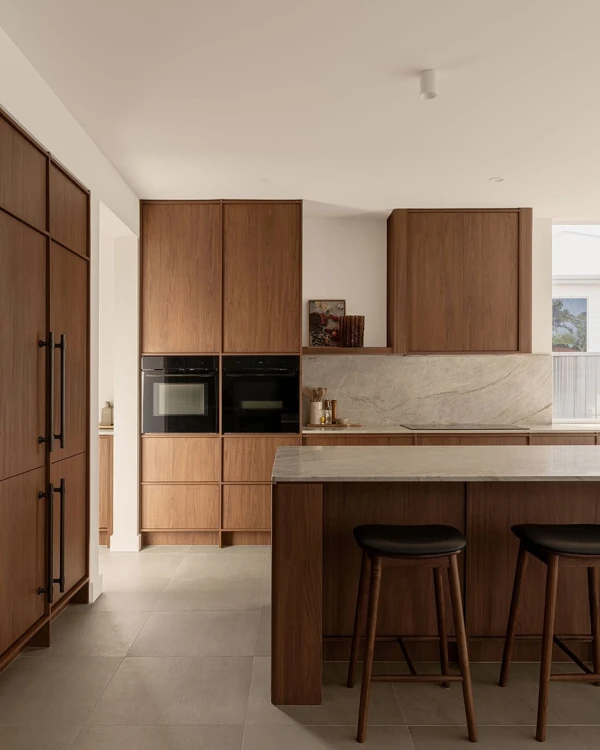 Walnut Cabinetry with Sleek Black Appliances