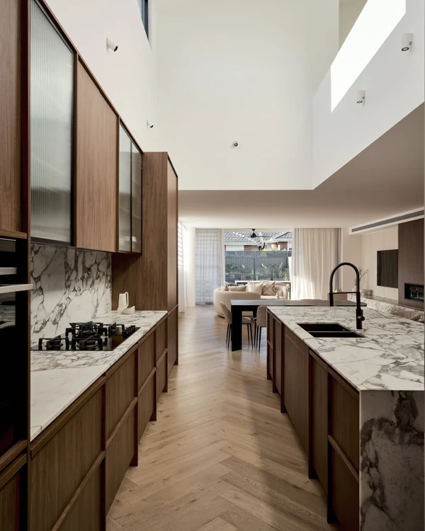 Skylit Walnut Kitchen with Marble Counters