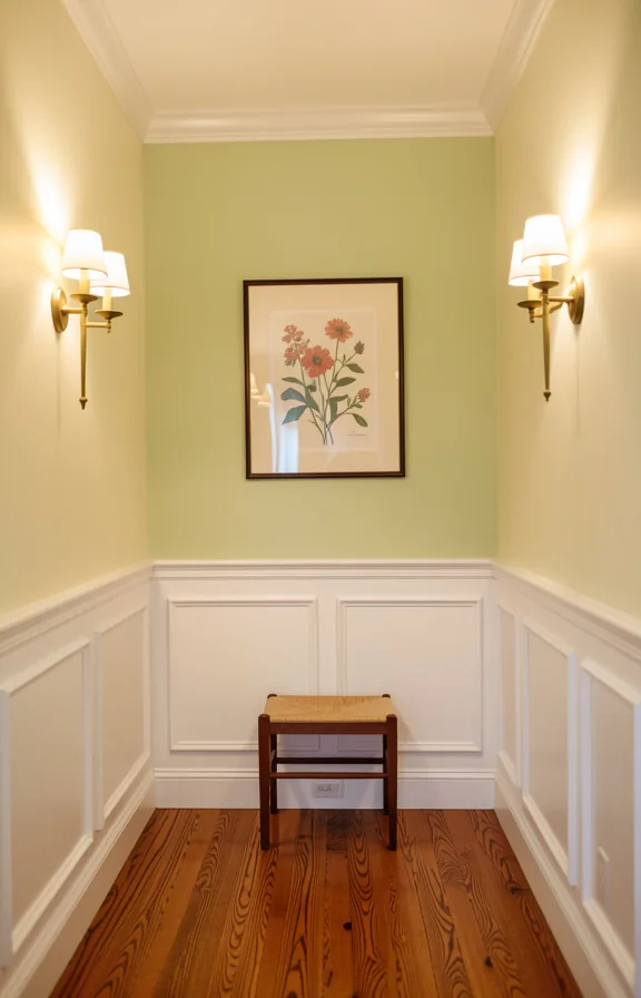 Traditional entryway with white wainscoting covering lower half of walls