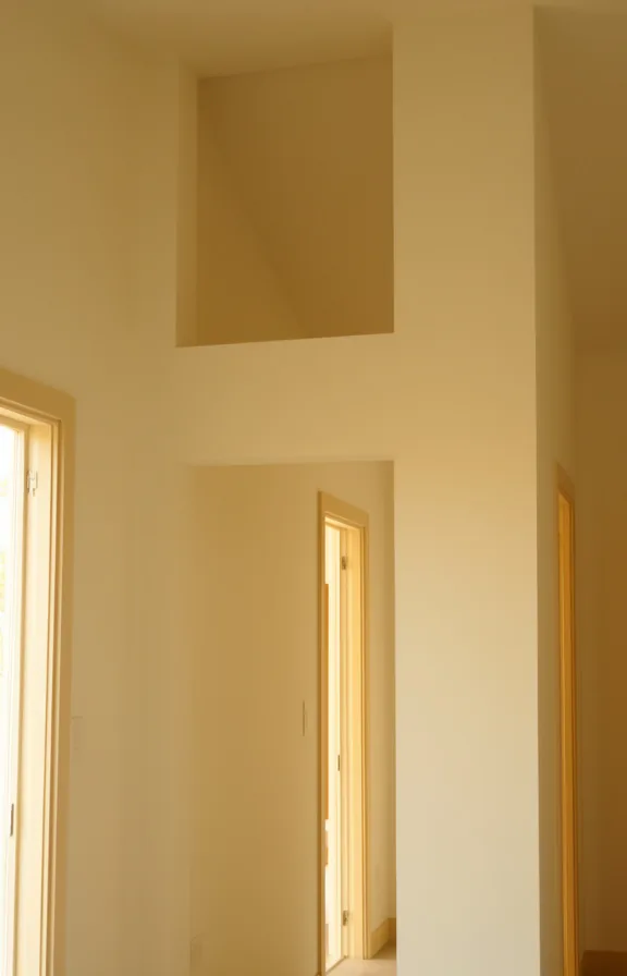 wasted wall real estate visible, cream walls, soft golden afternoon light