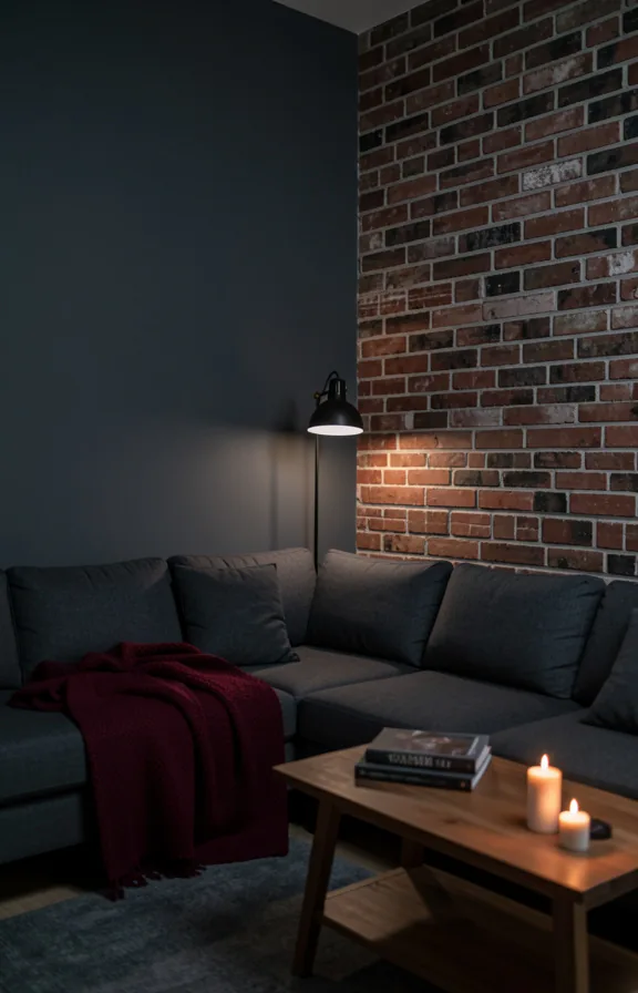 dark gray sectional sofa, exposed brick accent wall