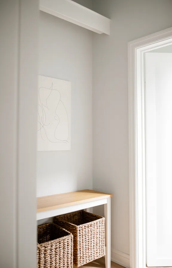 white painted door frame, simple wooden console table in natural light finish